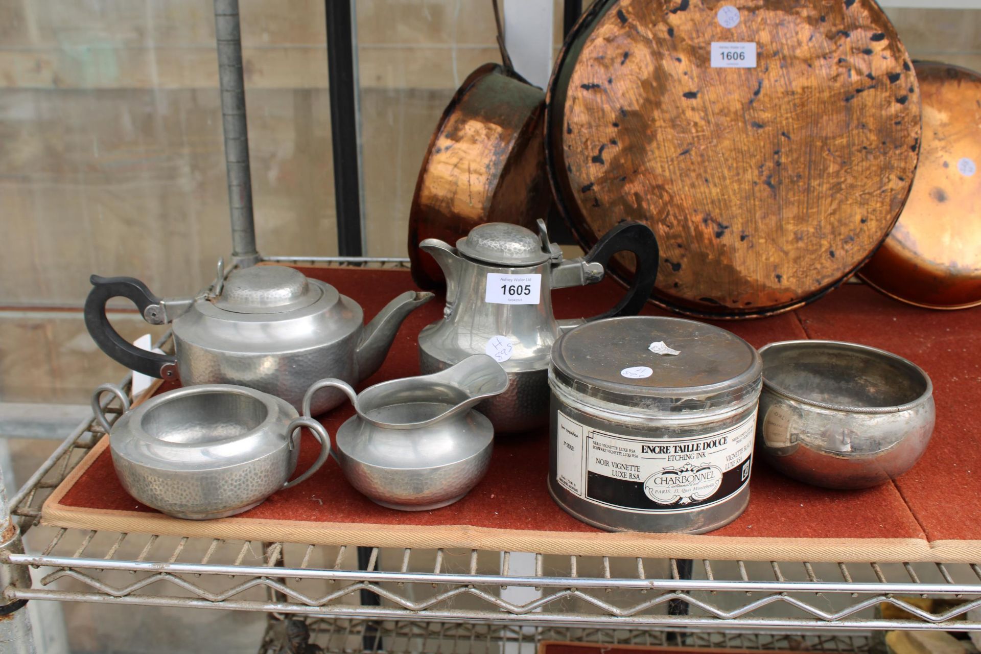 AN ASSORTMENT OF ITEMS TO INCLUDE A BEATEN PEWTER TEA SERVICE AND A TIN OF ENCRE TAILLE DOUCE