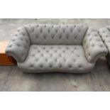 A LEATHER CHESTERFIELD STYLE BUTTON BACK THREE SEATER SETTEE ON TURNED LEGS