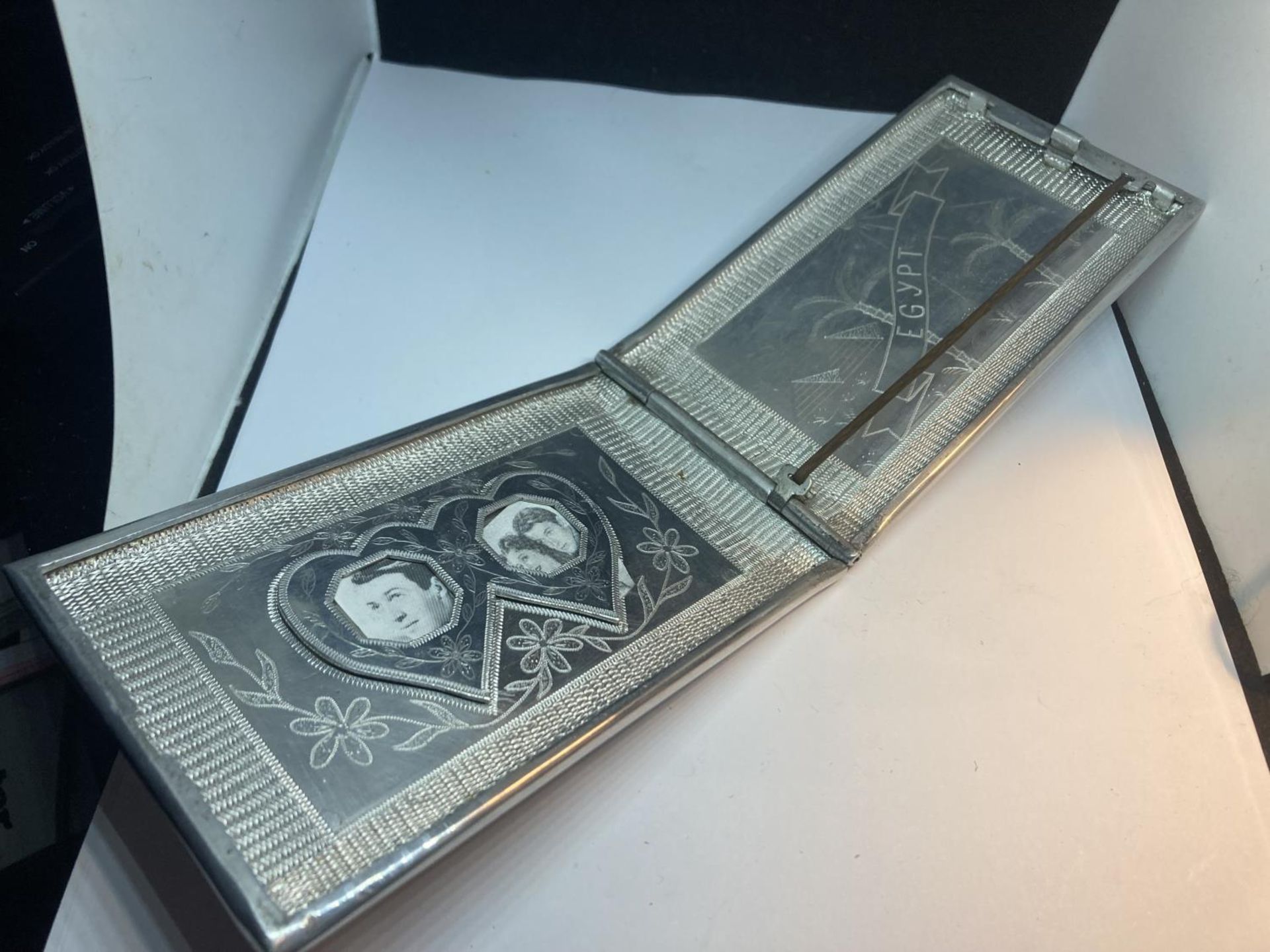 AN UNUSUAL WHITE METAL AND ENAMEL CIGARETTE CASE DEPICTING INDIA, EGYPT AND AFRICA WITH HEART SHAPED - Image 3 of 5