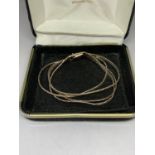 A SILVER STRAND BRACELET IN A PRESENTATION BOX