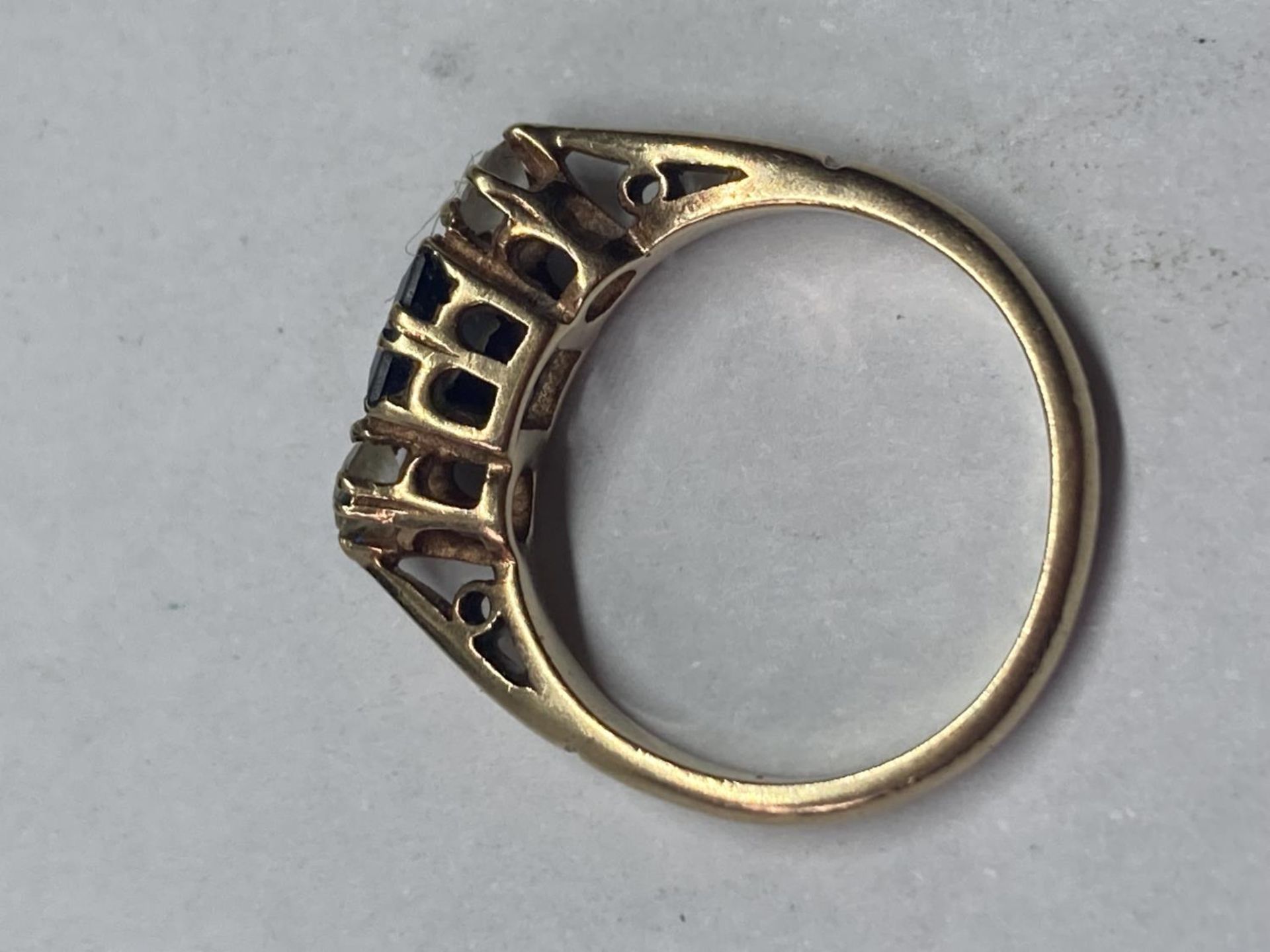 A 9 CARAT GOLD RING WITH CENTRE SAPPHIRE AND CUBIC ZIRCONIAS - Image 3 of 3