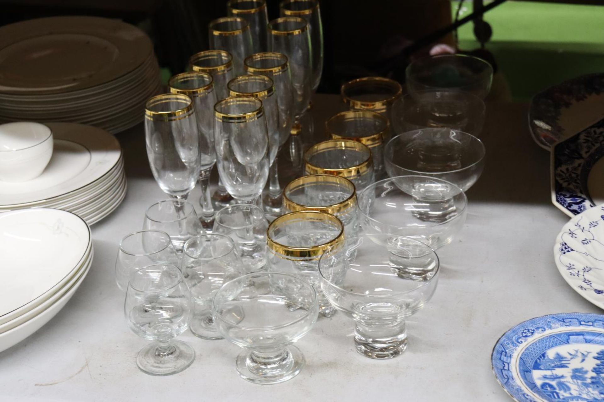 A QUANTITY OF DRINKING GLASS AND DESSERT BOWLS