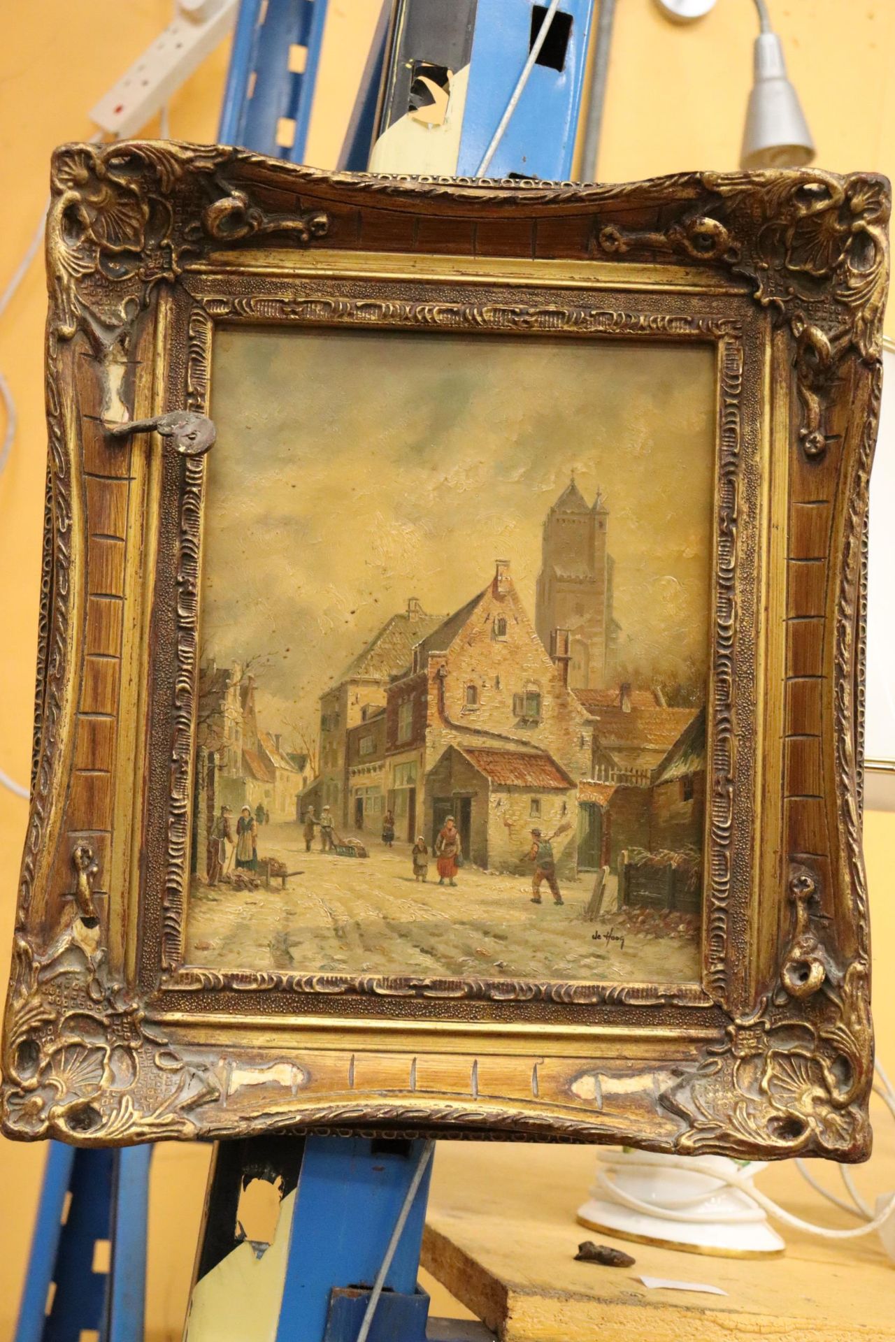 AN OIL ON BOARD OF A TOWN SCENE, SIGNED DE HOOG, 30CM X 36CM