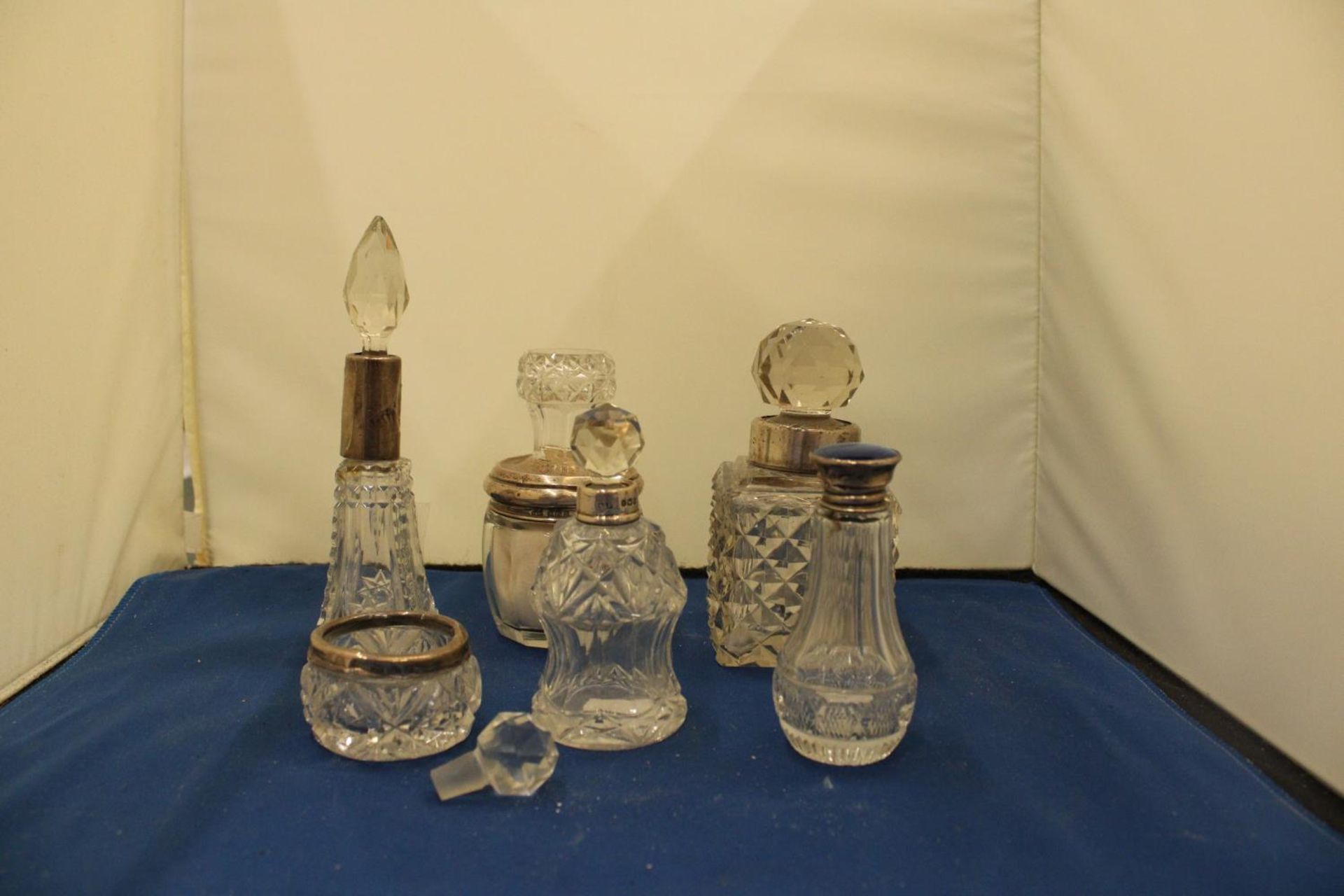 SIX PIECES OF GLASSWARE WITH MARKED SILVER COLLARS, LIDS, RIMS TO INCLUDE A BLUE ENAMEL
