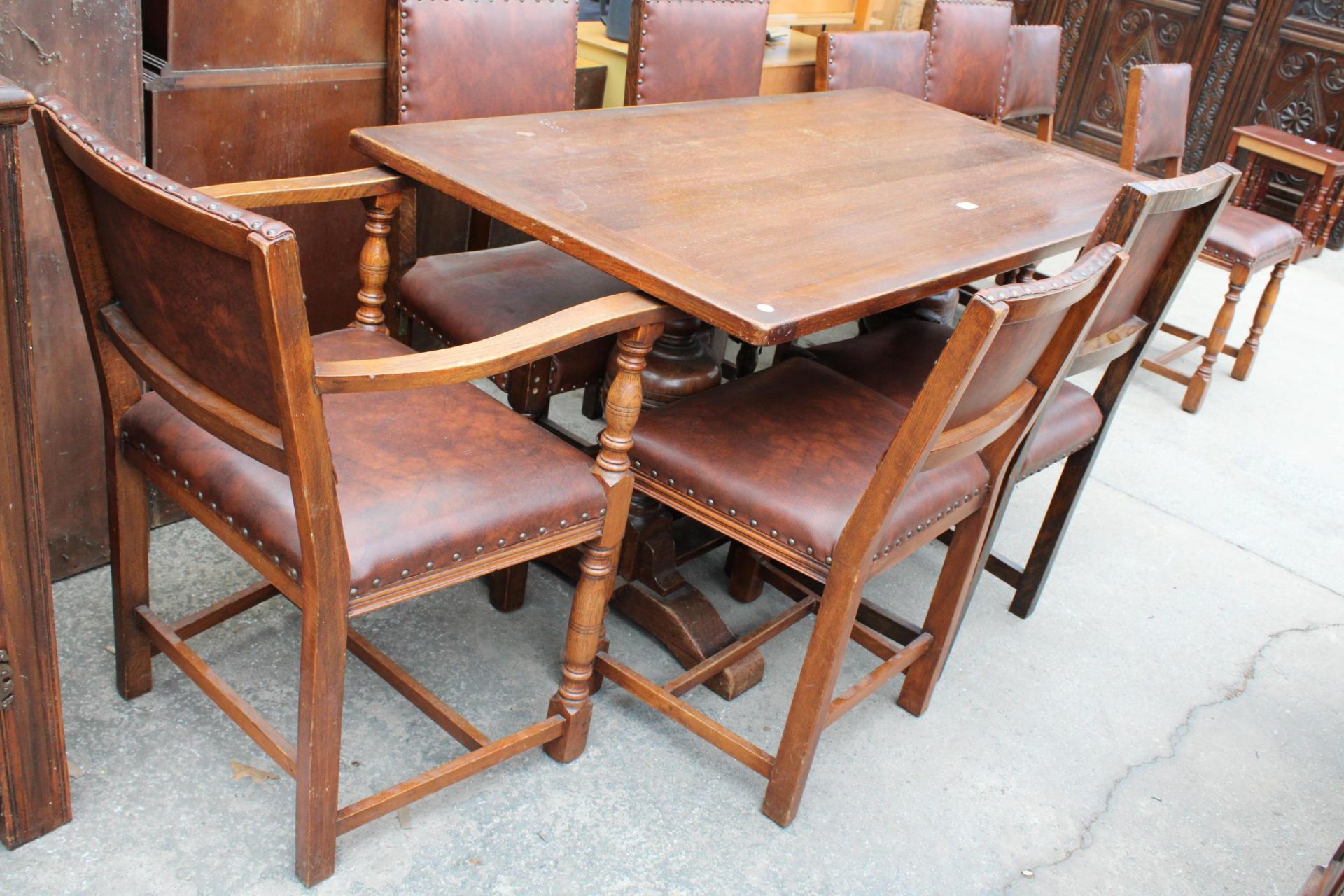 A MID 20TH CENTURY OAK REFECTORY TABLE, 57" X 30" AND NINE STUDDED DINING CHAIRS, ONE BEING A CARVER - Image 6 of 6