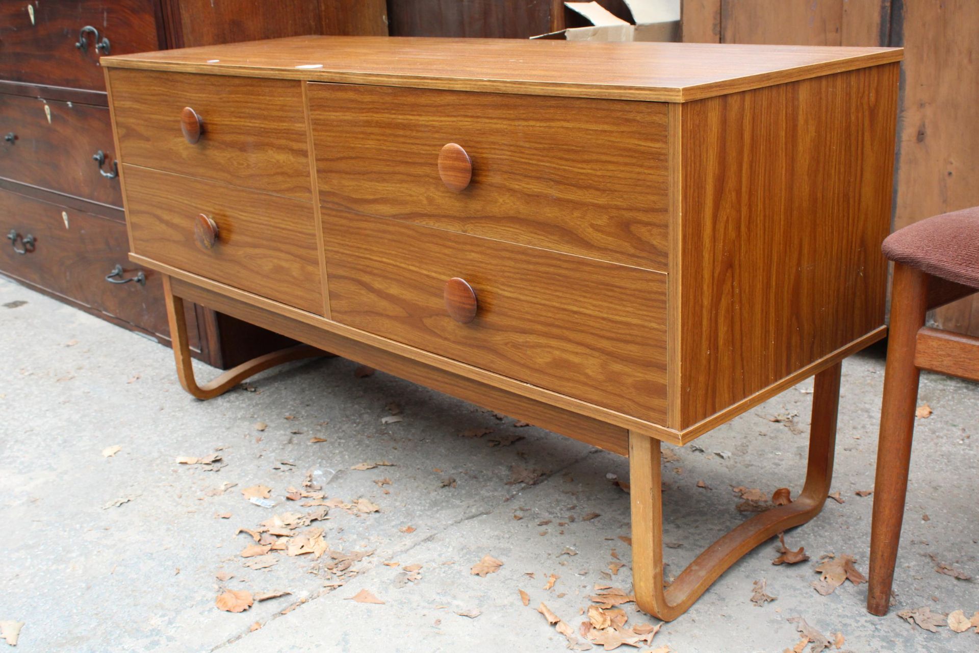 A RETRO TEAK EFFECT CHEST OF FOUR DRAWERS ON OPEN BASE 51" WIDE - Image 2 of 2