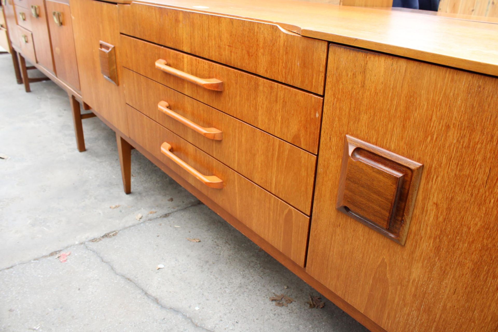 A TEAK BEAUTILITY SIDEBOARD ENCLOSING FOUR DRAERS AND TWO CUPBOARDS, 72" WIDE - Image 4 of 5