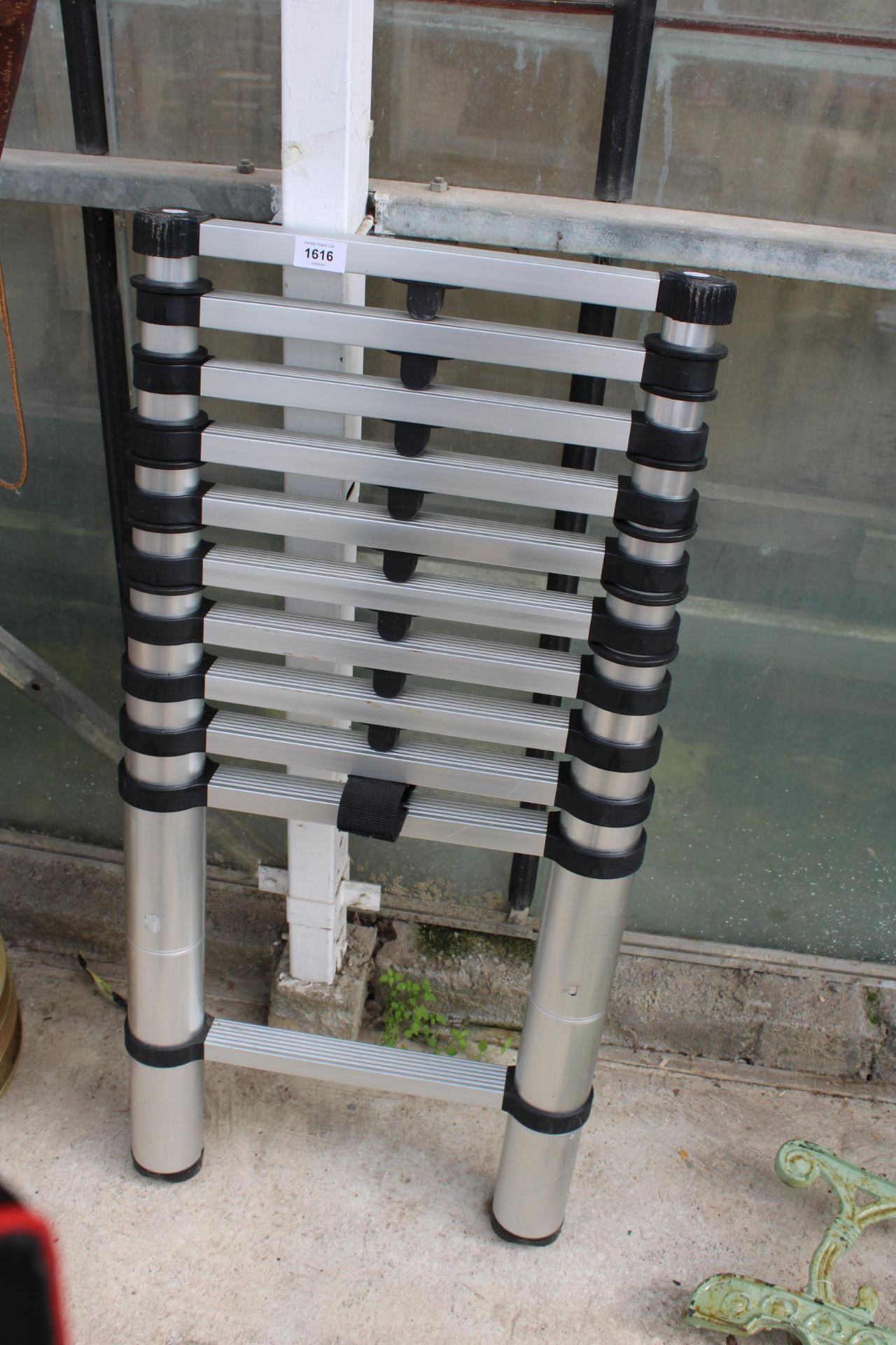 A SET OF ALU TELESCOPIC LADDERS