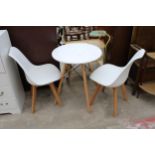 A WHITE MELAMINE TABLE ON KICK OUT LEGS 24" DIAMETER AND A PAIR OF SIMILAR CHAIRS