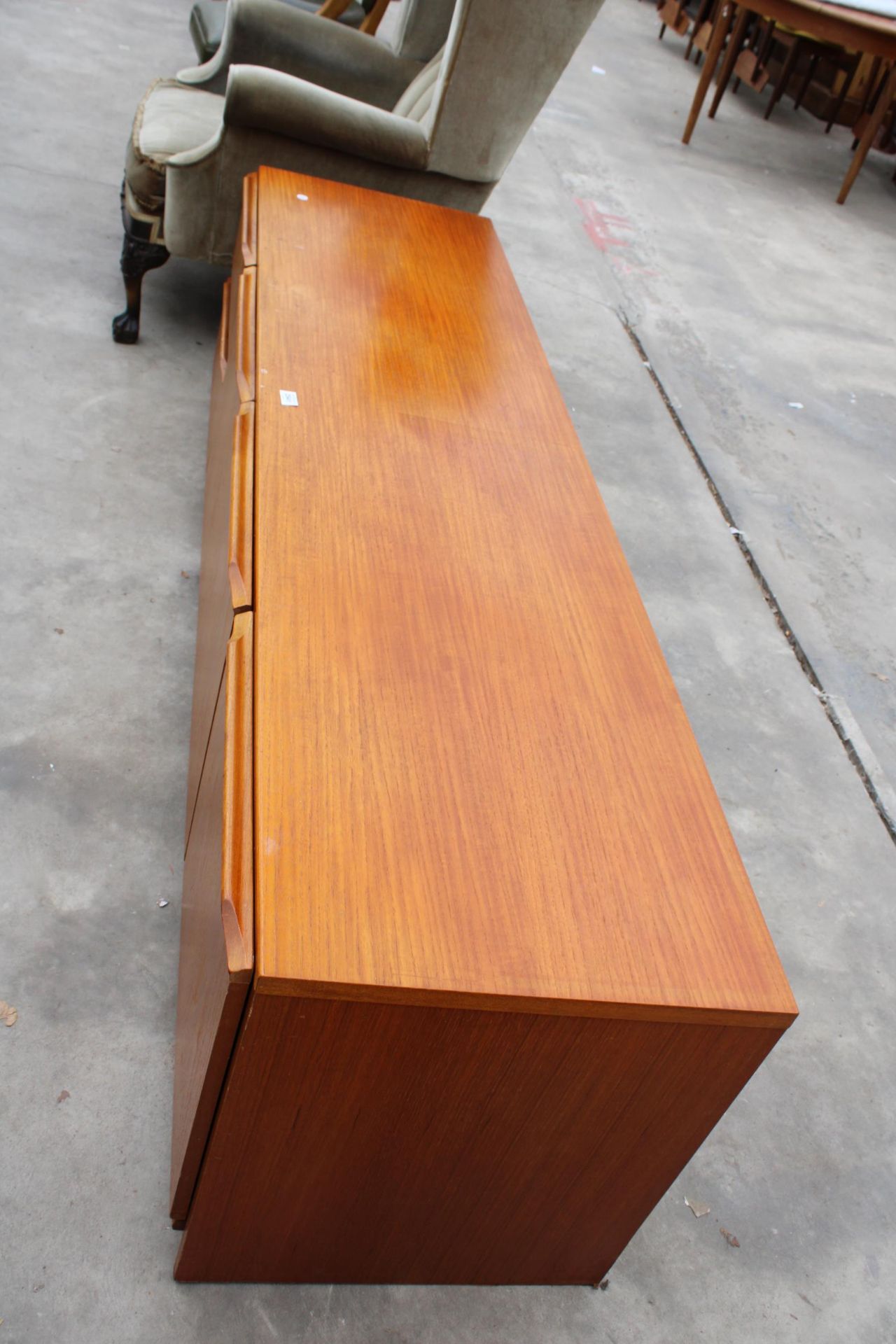 A RETRO TEAK LOW UNIT ENCLOSING TWO DRAWERS AND THREE CUPBOARDS, 72" WIDE - Image 2 of 2