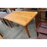 A PINE KITCHEN TABLE ON TURNED LEGS 59" X 31"