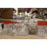 A LARGE QUANTITY OF GLASSWARE TO INCLUDE SUGAR BOWLS, DECANTERS, FOOTED CAKE PLATE, BELL, ETC.,
