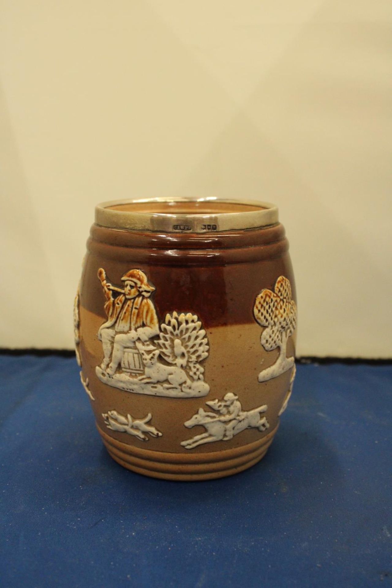 A DOUTLON LAMBETH JAR WITH A HALLMARKED LONDON SILVER RIM