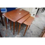 A RETRO TEAK NEST OF THREE TABLES, STAMPED 'MADE IN DEN,MARK'