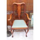 AN EARLY 20TH CENTURY BEECH FRAMED ELBOW CHAIR