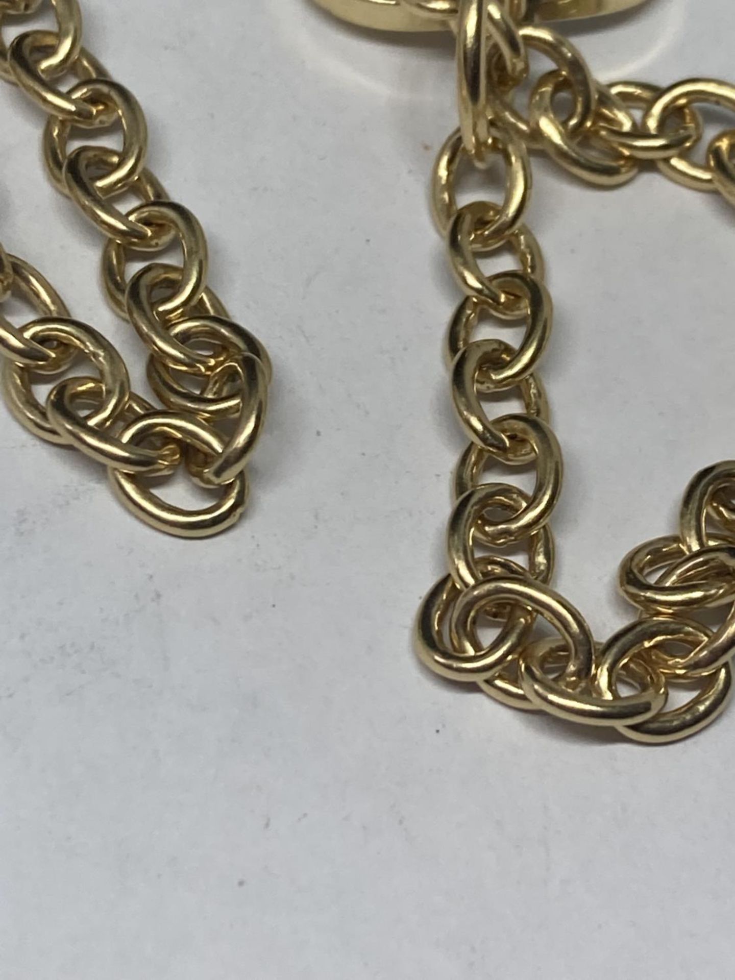 TWO GOLD PLATED T BAR BRACELETS AND A WHITE METAL DOLPHIN PENDANT NECKLACE - Image 2 of 3