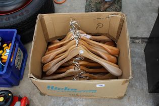 A BOX CONTAINING 26 LARGE WOODEN COAT HANGERS