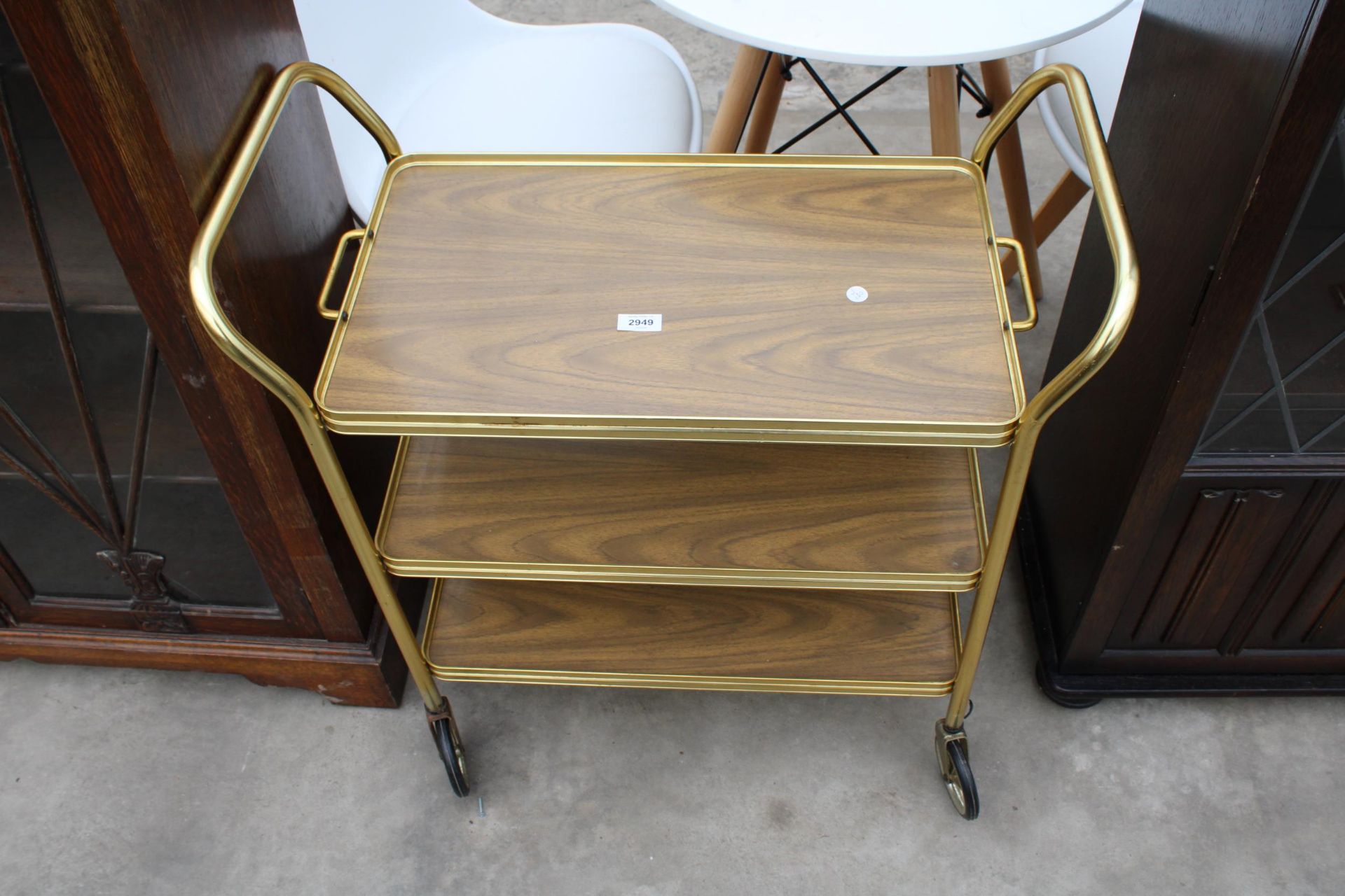 A 1970'S THREE TIER METALWARE TROLLEY WITH DETACHABLE TRAY