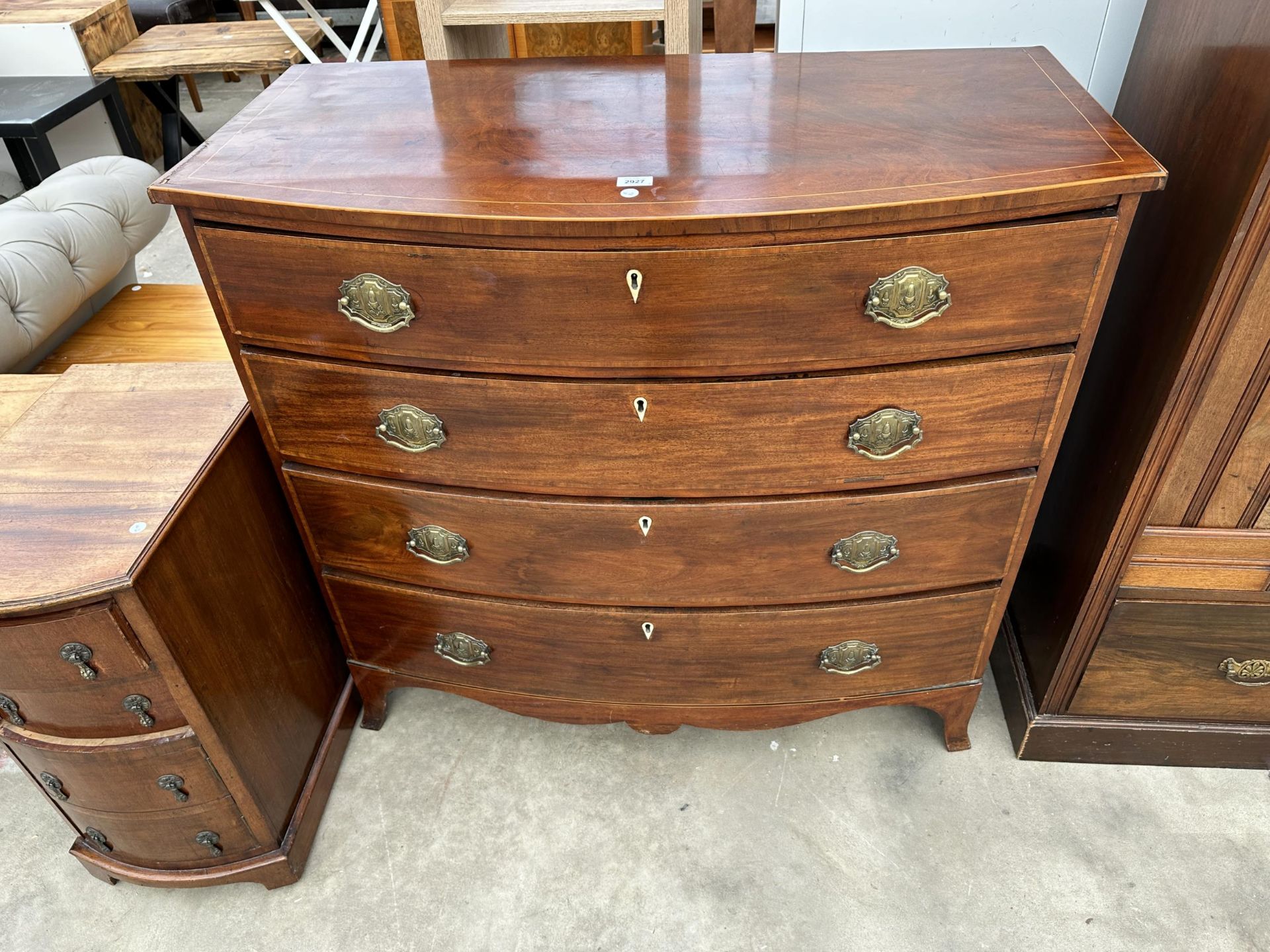 A 19TH CENTURY MAHOGANY INLAID AND CROSSBANDED CHEST OF FOUR GRADUATED DRAWERS, 43" WIDE