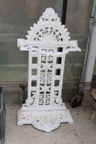 AN ANTIQUE CAST IRON STICK STAND WITH DRIP TRAY