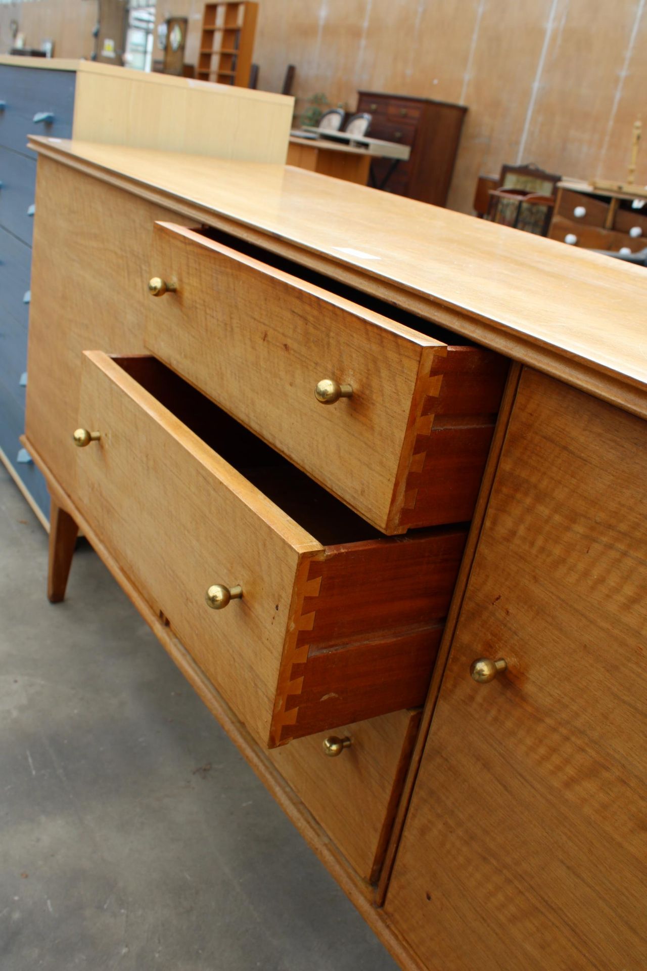 A RETRO HANDCRAFT ALFRED COX WALNUT SIDEBOARD ENCLOSING THREE DRAWERS AND TWO CUPBOARDS, 67" WIDE - Image 4 of 6