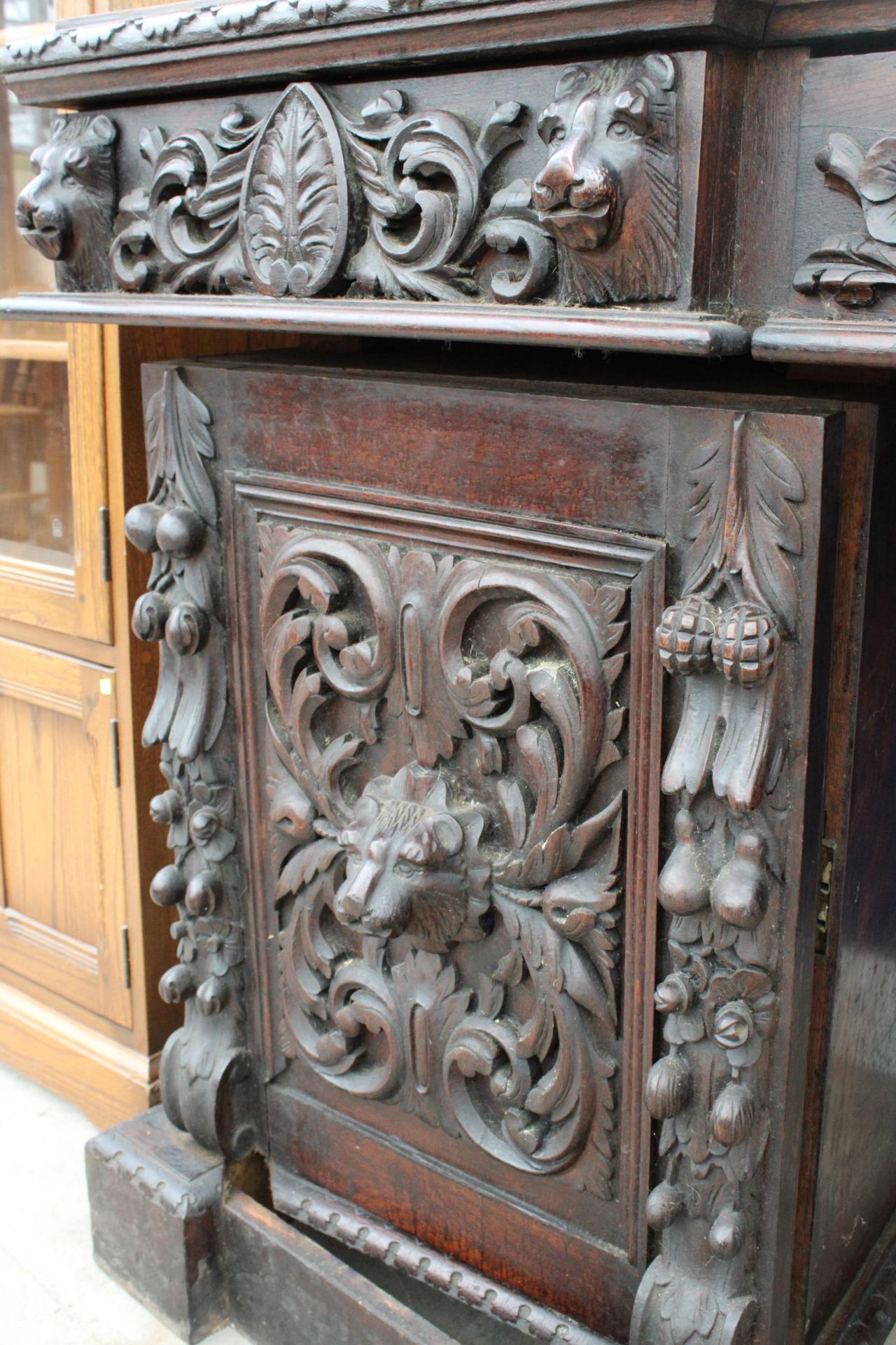 A VICTORIAN OAK BLACK FOREST STYLE MIRROR BACK SIDEBOARD HEAVILY CARVED WITH LION MASK HEAD AND - Image 3 of 7