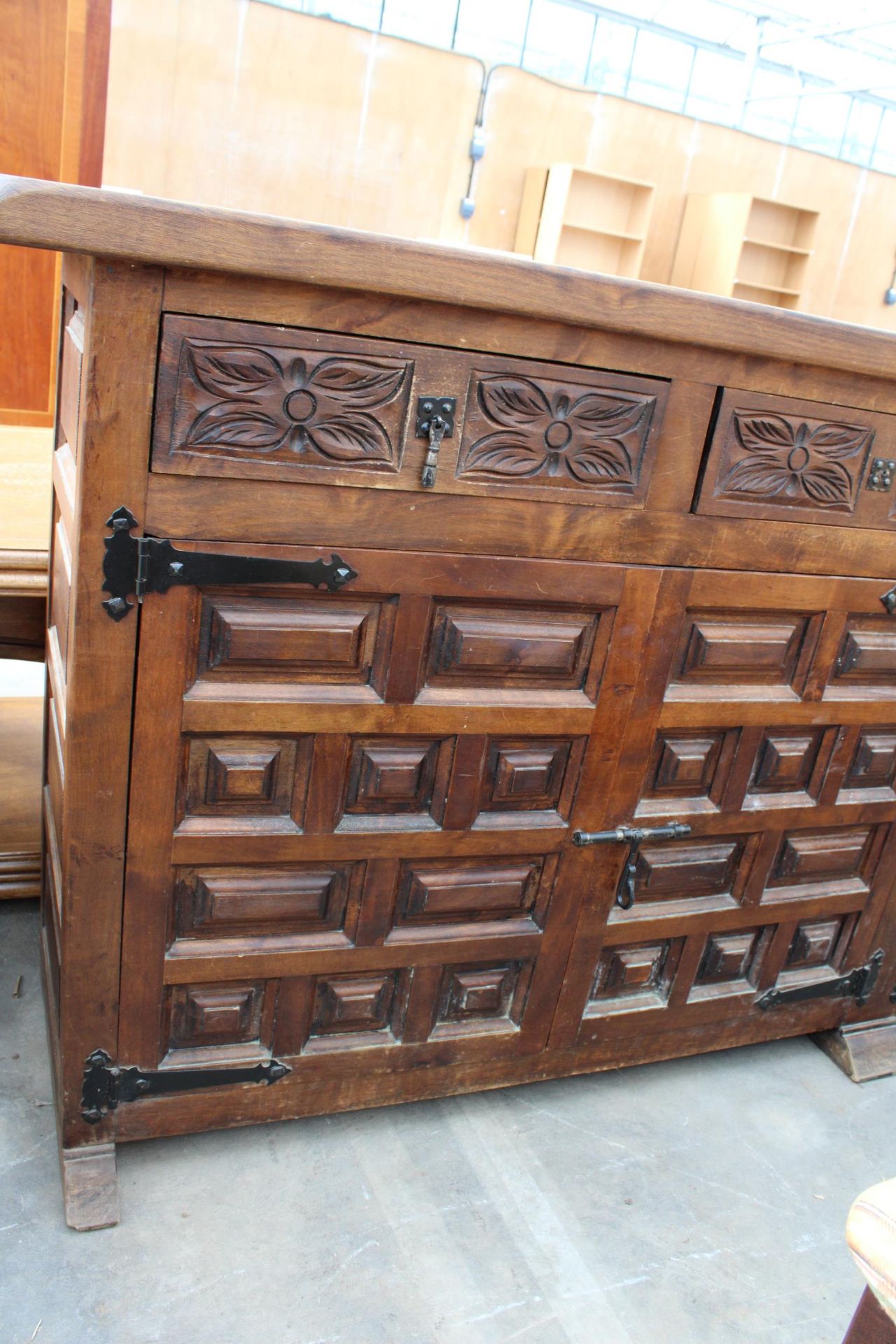 A MODERN SPANISH STYLE HARDWOOD SIDEBOARD WITH RAISED PANEL DOORS AND CARVED DRAWERS, 77" WIDE - Image 3 of 5