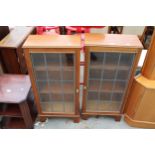 A PAIR OF CUPBOARDS WITH GLAZED AND LEADED DOORS 17.5" WIDE