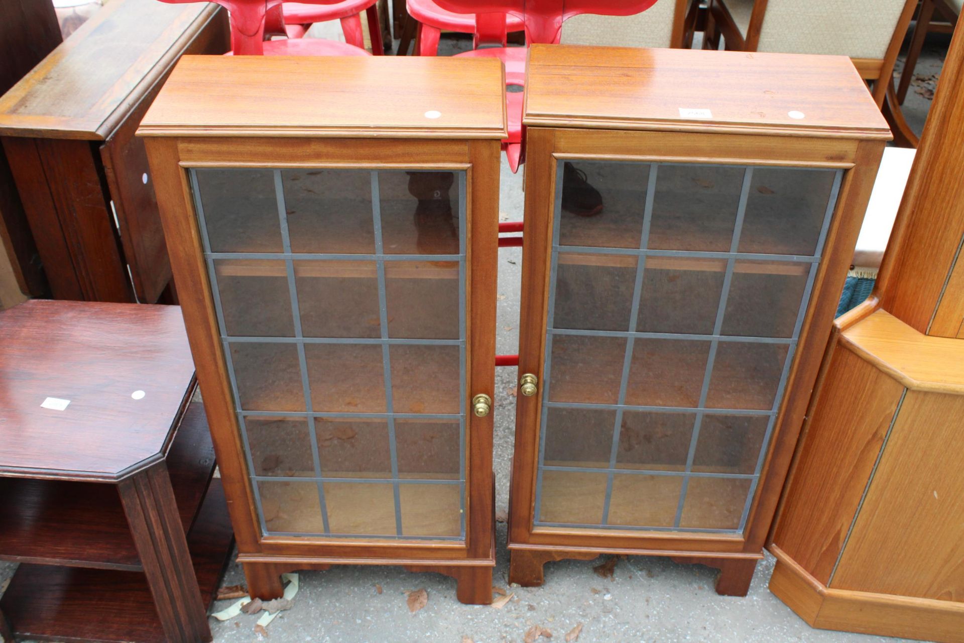 A PAIR OF CUPBOARDS WITH GLAZED AND LEADED DOORS 17.5" WIDE