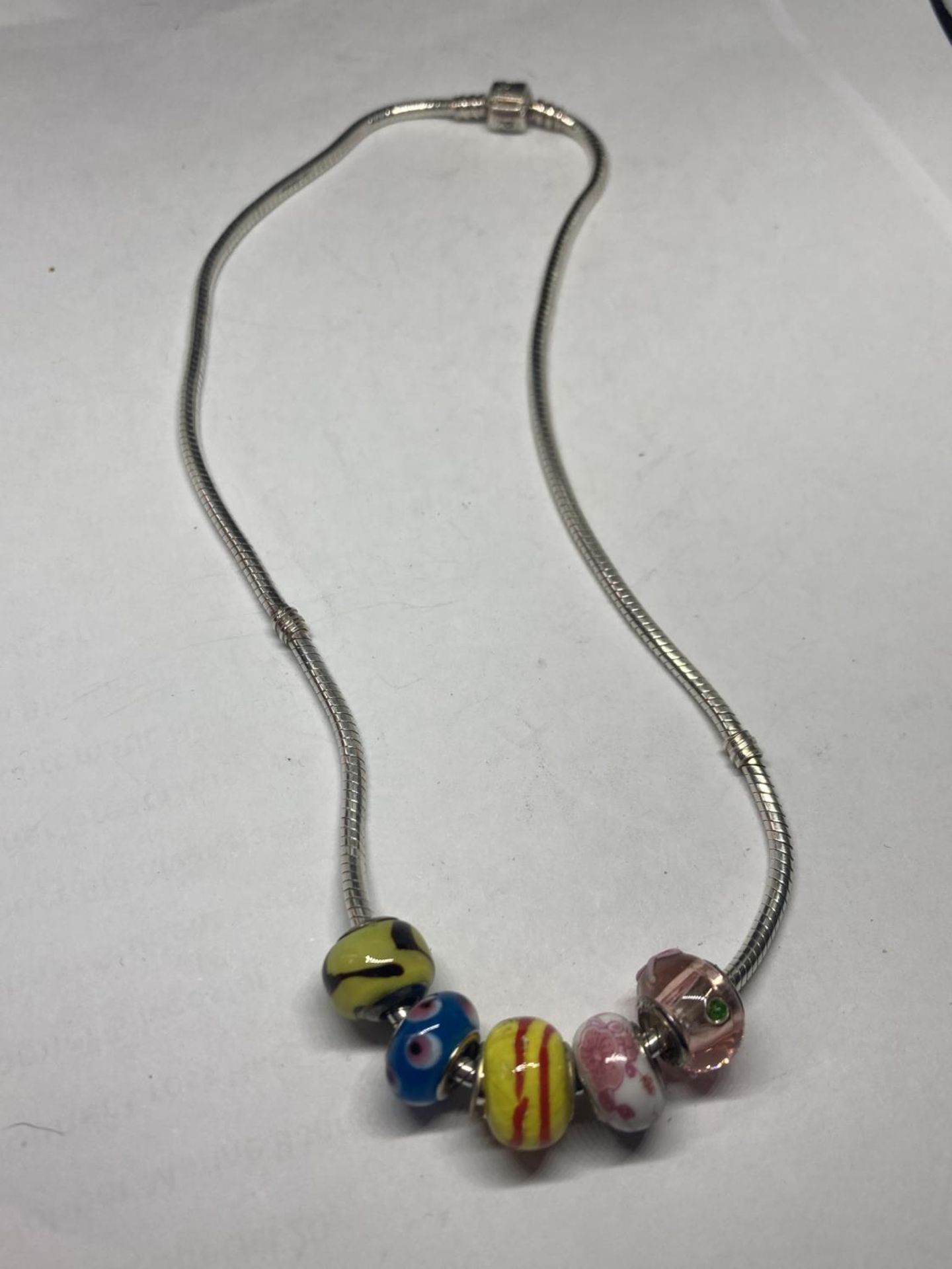 A PANDORA STYLE SILVER NECKLACE WITH FIVE GLASS CHARMS