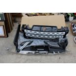 AN ASSORTMENT OF LAND ROVER CAR SPARES TO INCLUDE GRILLS AND A BOOT LINER ETC