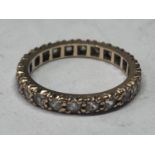 A 9 CARAT GOLD BAND RING WITH CUBIC ZIRCONIAS ALL ROUND SIZE L/M