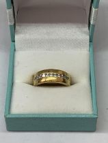 A SILVER GILT AND STONE RING IN A PRESENTATION BOX