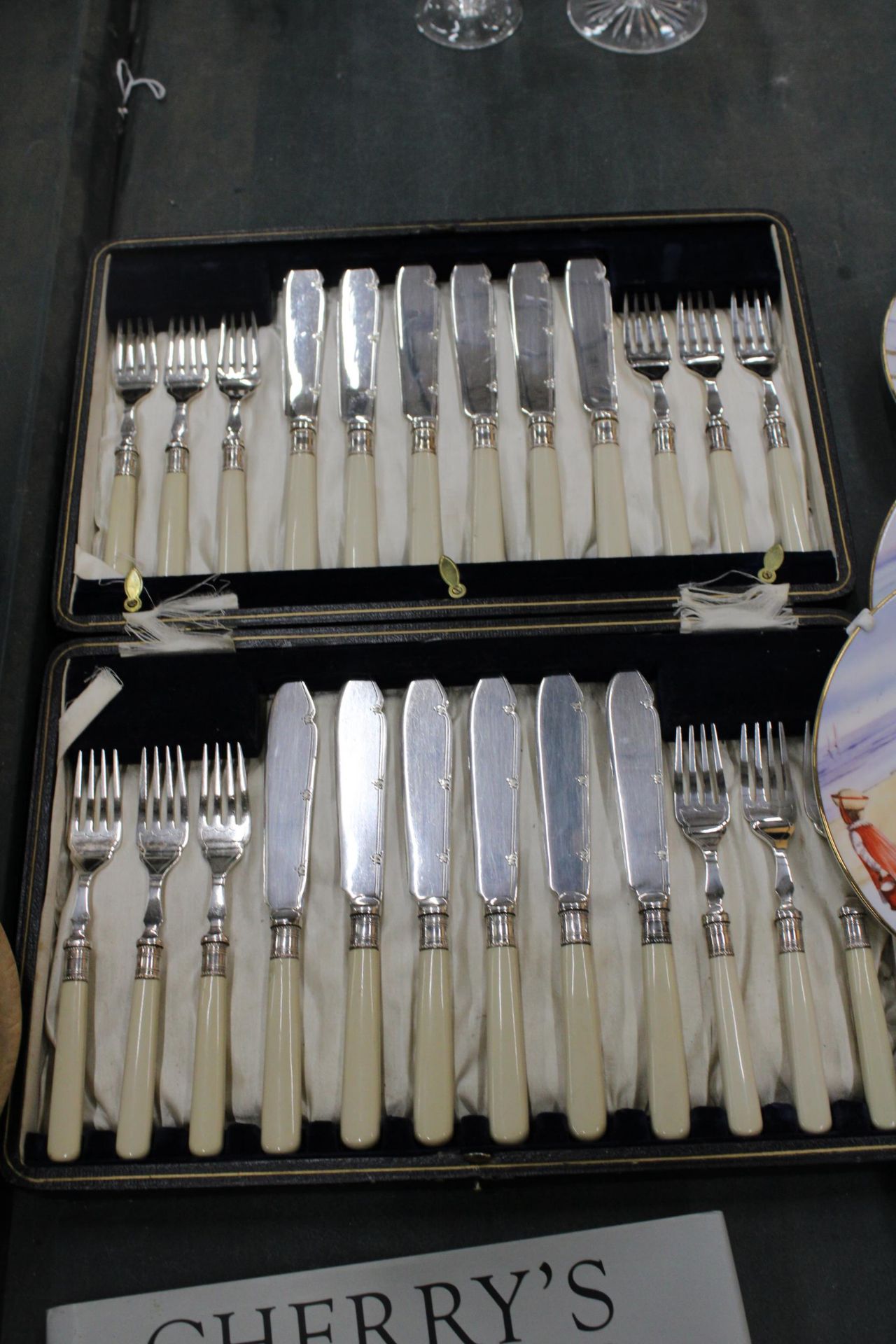 A CASED FISH KNIFE AND FORK SET