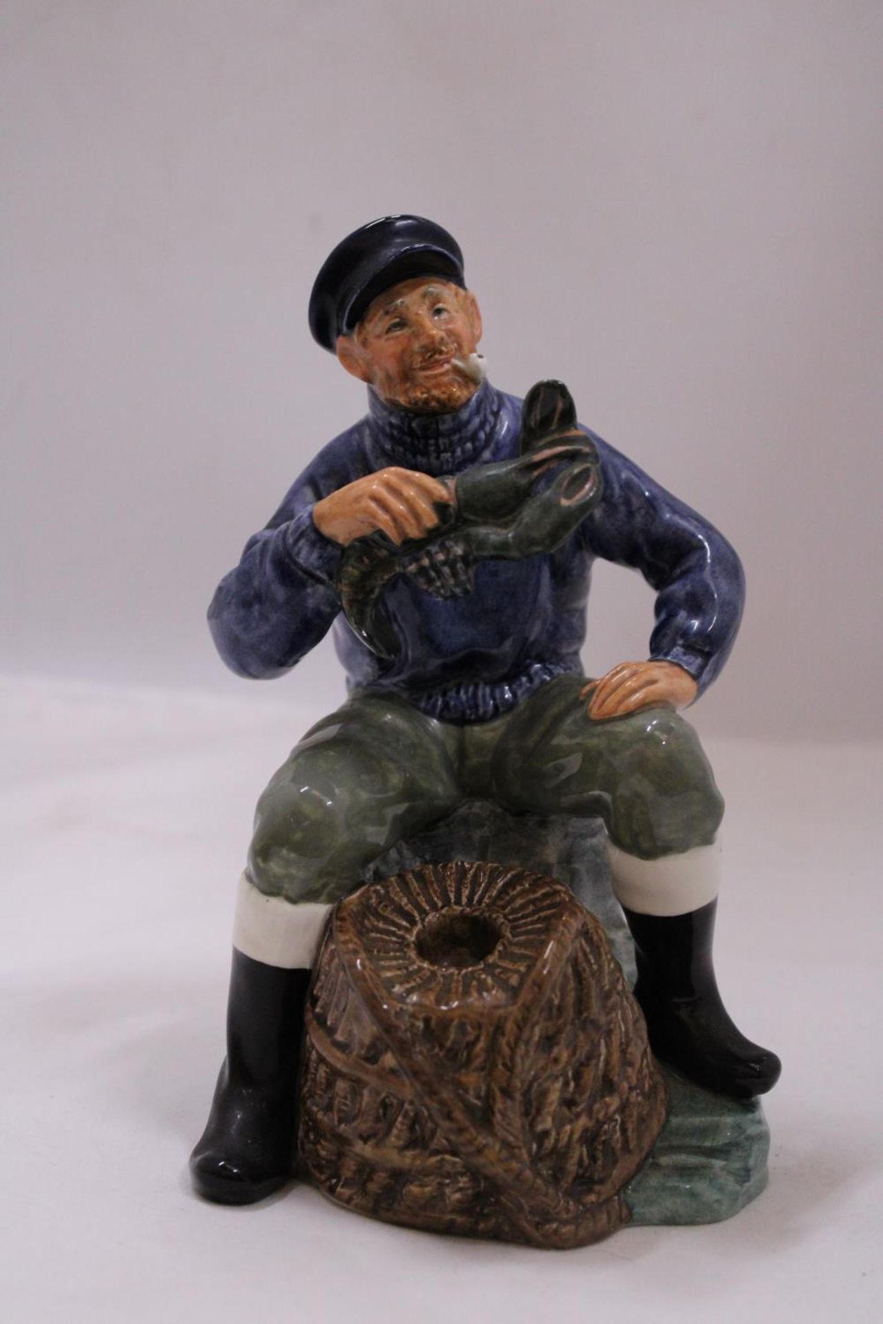 A ROYAL DOULTON "THE LOBSTER MAN" FIGURINE HN2317