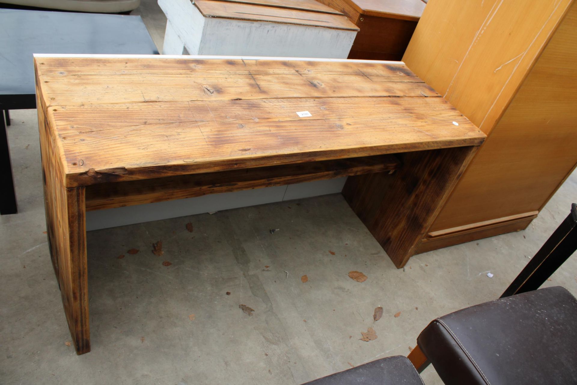 A MODERN PLANK TOP TABLE WITH UNDER SHELF 47" X 17"
