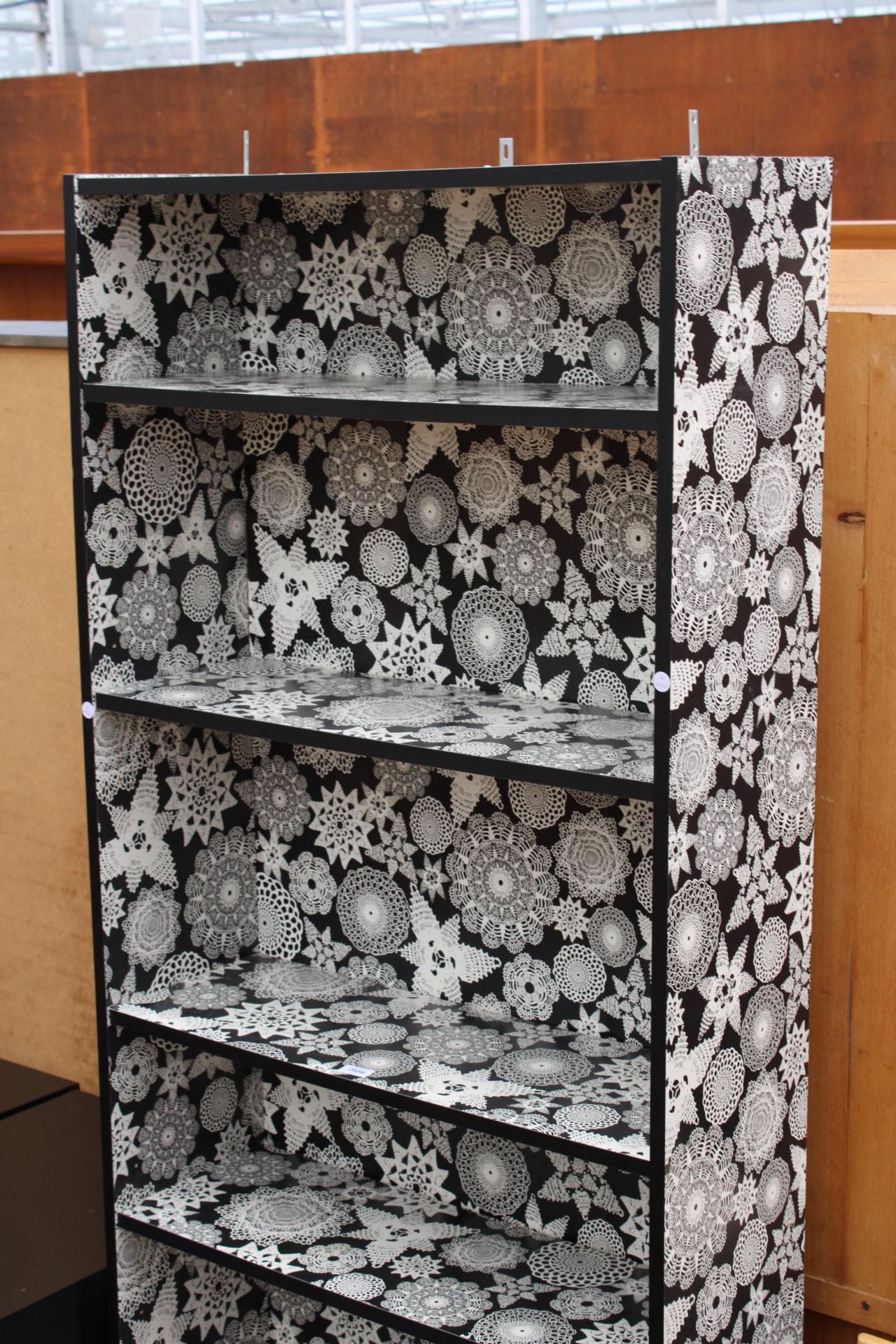 A MODERN SIX TIER OPEN BOOKSHELF WITH BLACK AND WHITE DECORATION DEPICTING DOILIES, 31.5" WIDE - Image 2 of 3