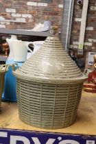 A VINTAGE FIVE GALLON DEMIJOHN AND BASKET