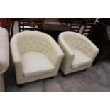 A PAIR OF MODERN CREAM FAUX LEATHER TUB CHAIRS