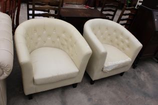 A PAIR OF MODERN CREAM FAUX LEATHER TUB CHAIRS