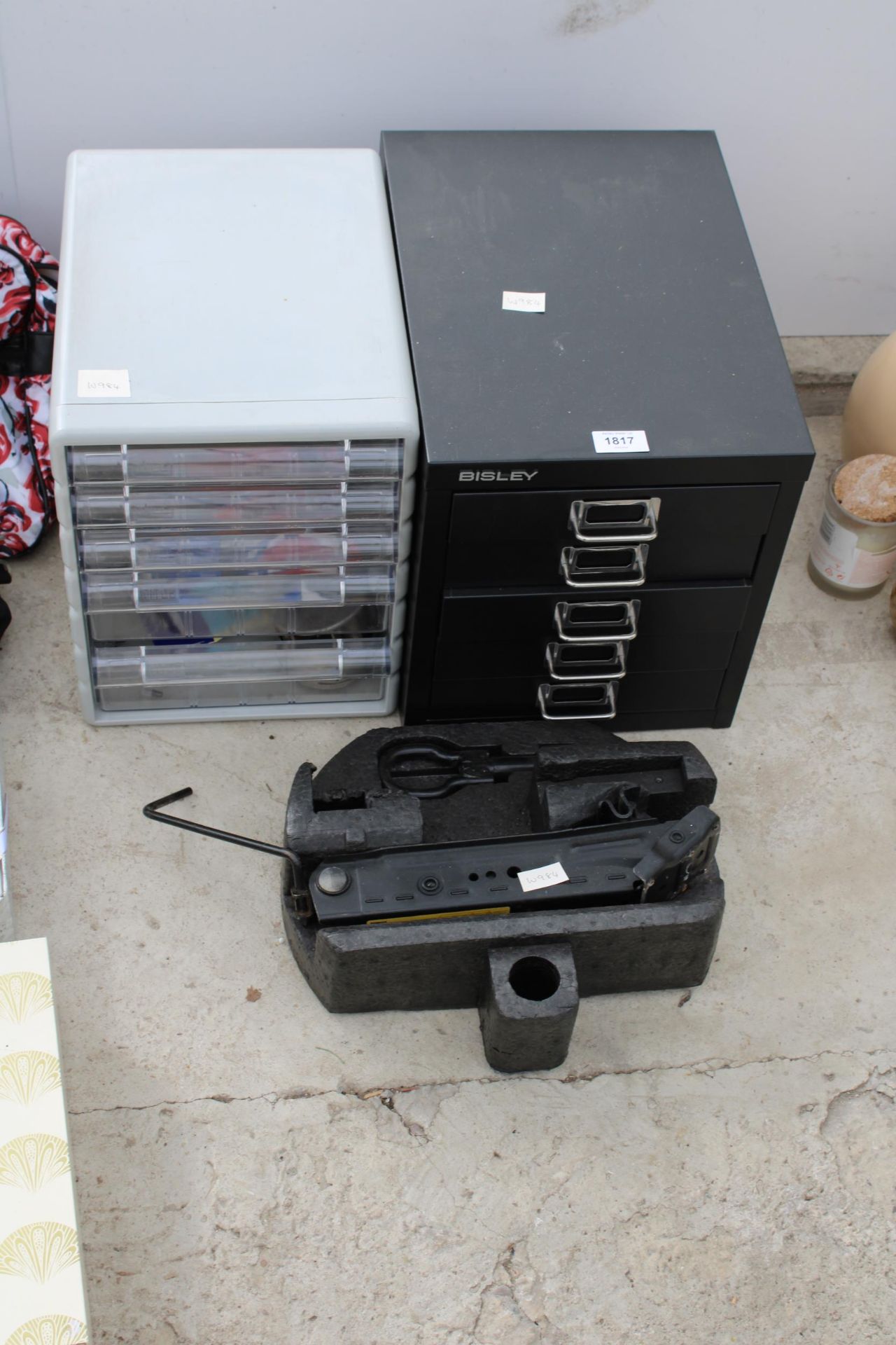 A MINIATURE BISLEY FIVE DRAWER FILING CABINET, A PLASTIC DRAWER UNIT AND A CAR JACK