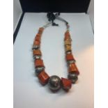 A HEAVY CORAL AND WHITE METAL NECKLACE