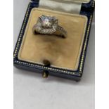 A SILVER SOLITAIRE RING IN A PRESENTATION BOX