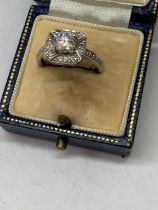 A SILVER SOLITAIRE RING IN A PRESENTATION BOX