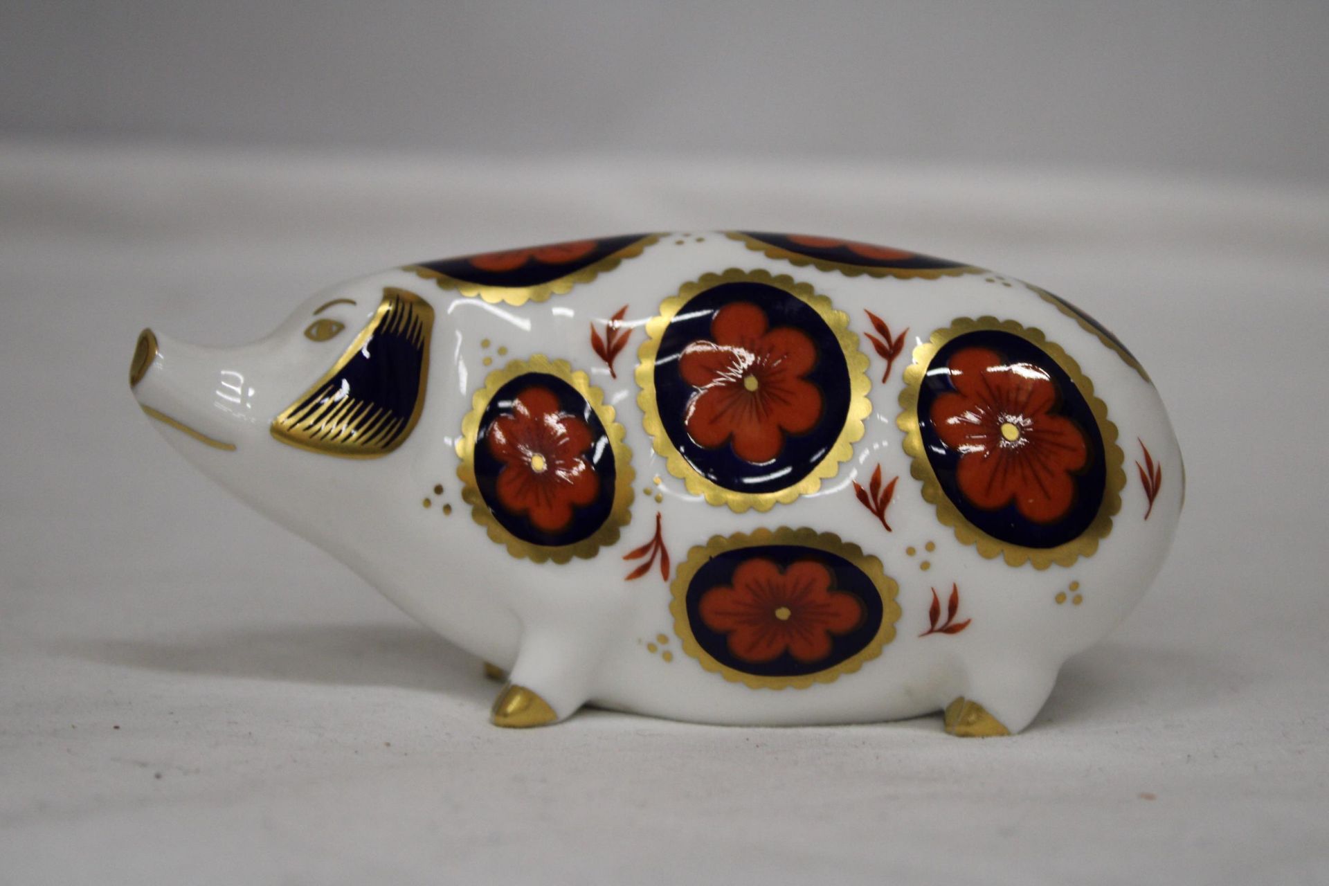 A ROYAL CROWN DERBY PIG (SECONDS)