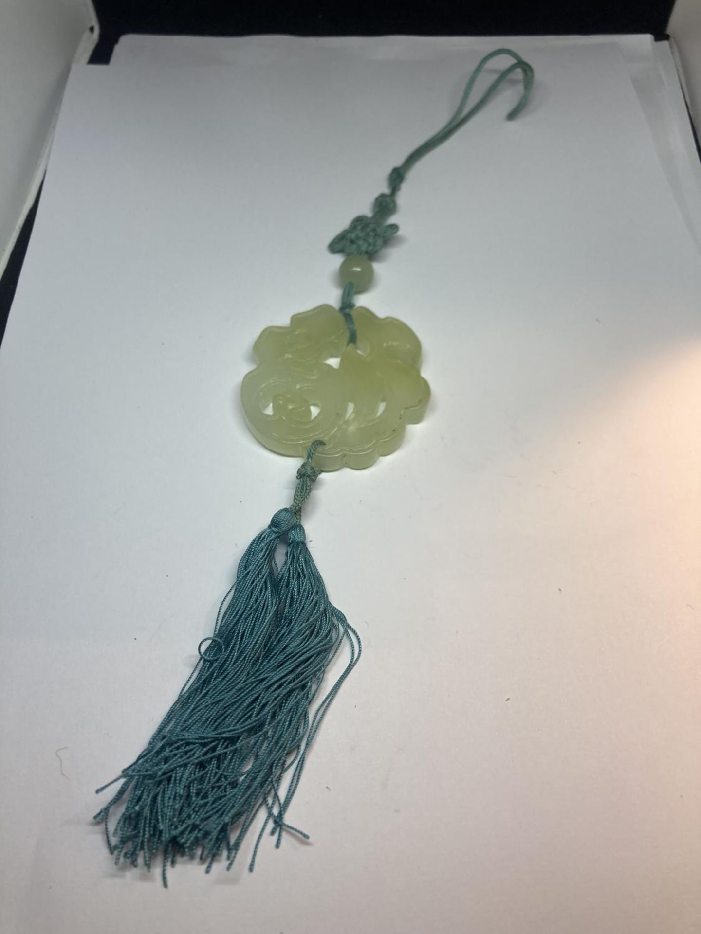 A JADE CARVED PENDANT