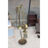 AN ASSORTMENT OF BRASS ITEMS TO INCLUDE A COMPANION SET, A PICTURE FRAME AND A DOR STOP ETC