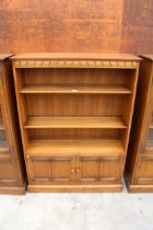 AN ERCOL BLONDE THREE TIER OPEN BOOKCASE WITH CUPBOARD TO BASE 39.5" WIDE