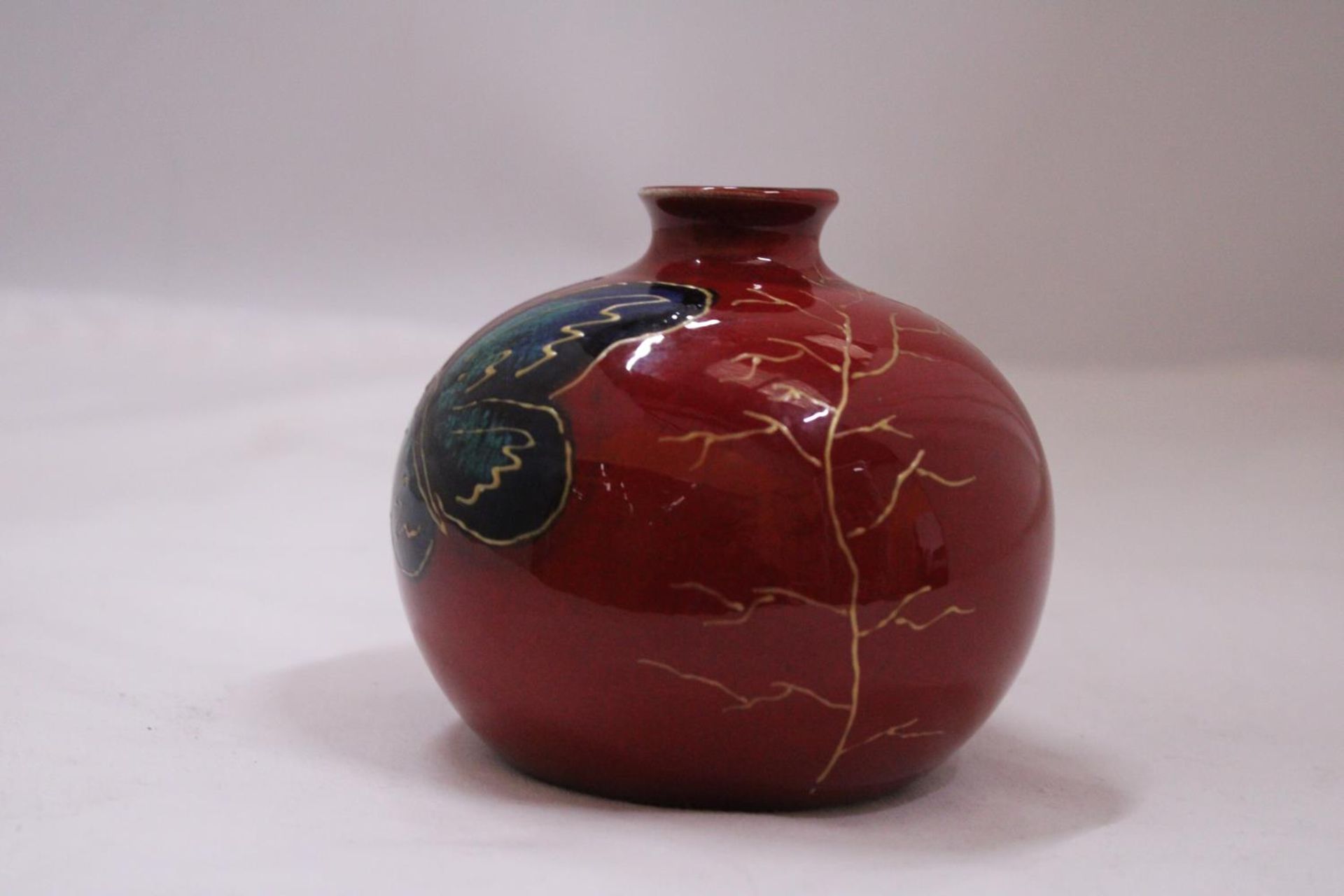 A SARAH EWIN HAND PAINTED VASE WITH BUTTERFLY