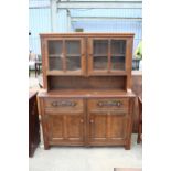 AN OAK AND BEECH E.GOMME FURNITURE DRESSER WITH GLAZED UPPER PORTION 55" WIDE